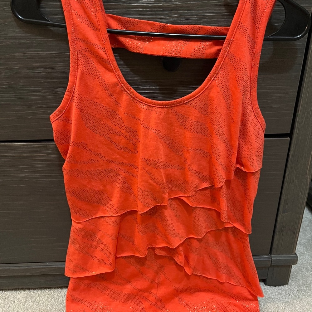 Orange top with gold glitter accent